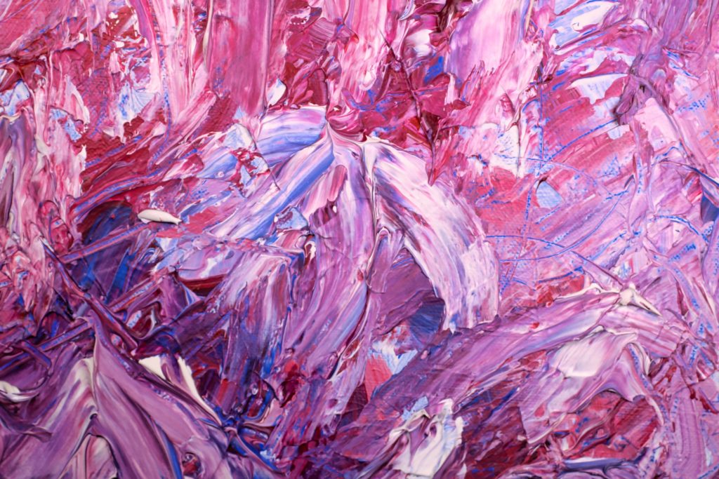 An abstract painting full of vibrant, pink colors.